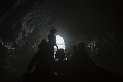 Silhouette people in cave
