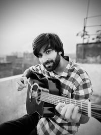 Young man playing guitar