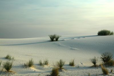 Idyllic shot of white sand in desert against sky