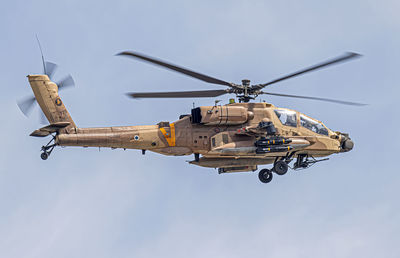 An ah-64d apache is
flying over the north.