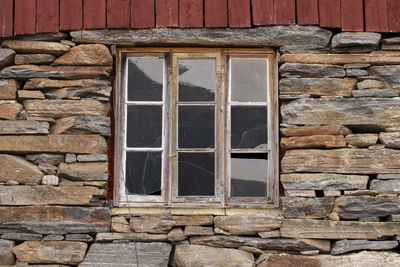 Low angle view of window on old building