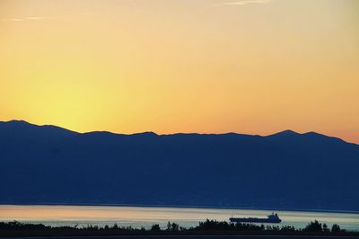 Scenic view of silhouette mountains against clear sky