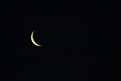 Scenic view of moon against clear sky at night