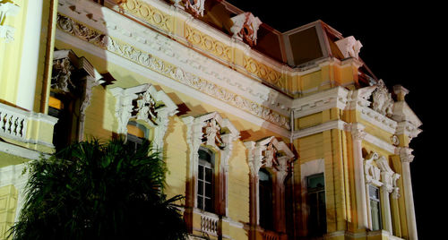 Low angle view of old building at night
