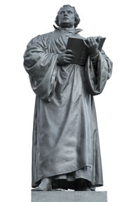 Low angle view of statue against white background