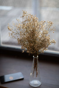 Close-up of white flower vase on table