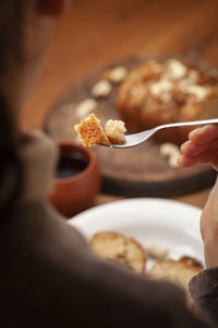 Close-up of woman eating breakfast