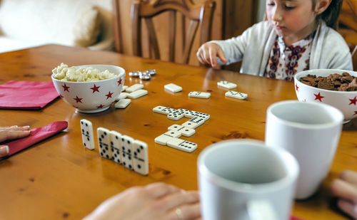 Close-up of boy playing with food on table