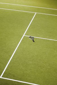 High angle view of tennis racket on court