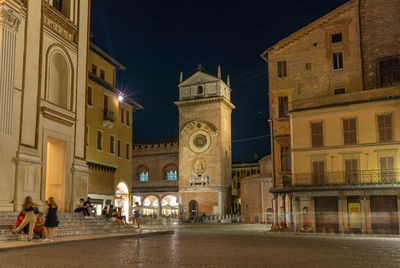 Illuminated buildings in city at night