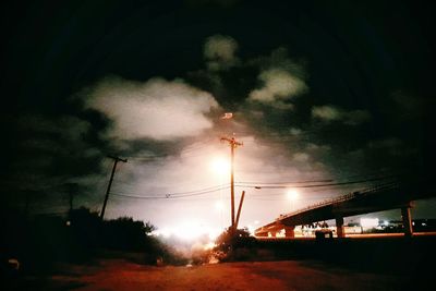 Low angle view of illuminated street light at night