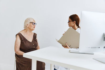 Woman using laptop on table