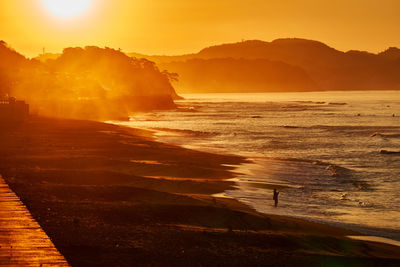 Scenic view of sea against sky during sunrise