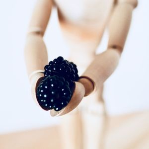 Close-up of woman hand over white background