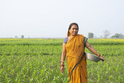 Woman standing in field