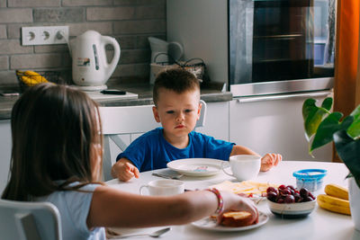 High angle view of people having food at home