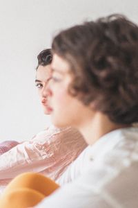 Portrait of woman lying on bed