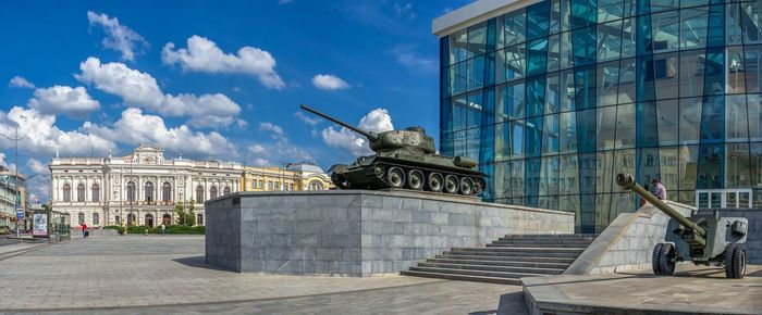 Statue of modern building against sky