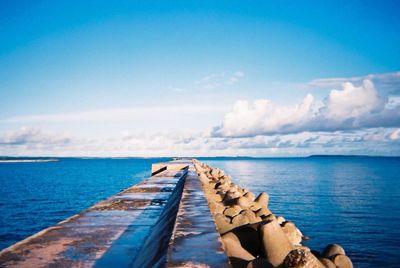 Scenic view of sea against blue sky