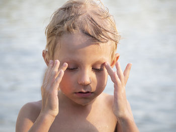 Close-up portrait of shirtless boy