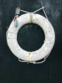 Lifebuoy ring hanging on wooden wall