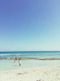 Friends playing at beach