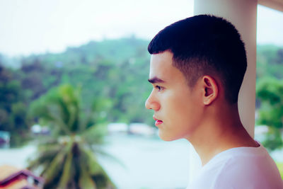 Portrait of teenage boy looking away