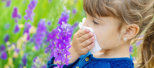 Close-up of girl blowing bubbles