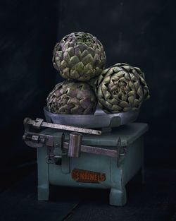 Close-up of artichokes on weight scale