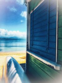 View of sea seen through window