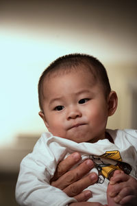 Portrait of cute boy holding camera