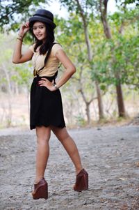 Portrait of beautiful young woman in park