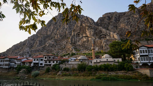 Buildings against mountain range