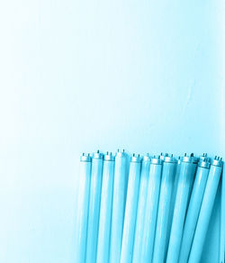 Close-up of blue glass against white background