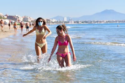 Women walking on beach