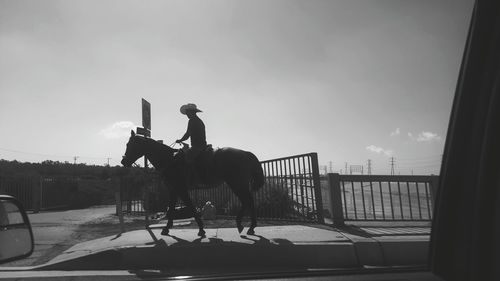 Man riding bicycle on empty park bench