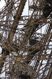 Low angle view of metallic structure against sky