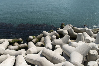 High angle view of tetrapods by sea