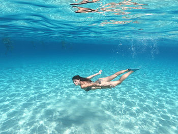 Woman swimming in sea