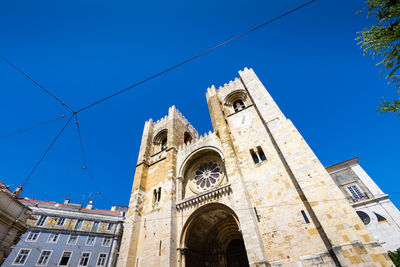 Low angle view of cathedral against blue sky