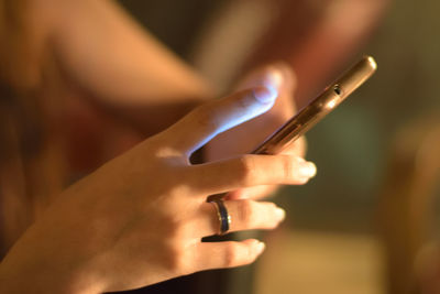 Close-up of hand holding cigarette