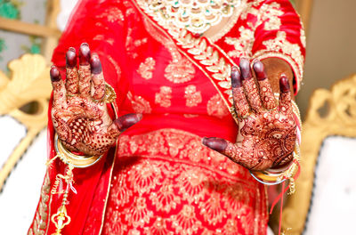 Close-up of woman with red umbrella