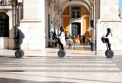 Full length of man with umbrella in city