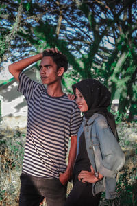 Young couple standing on land