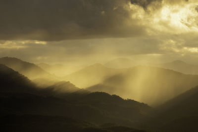 Scenic view of mountains against sky during sunset