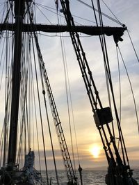 Low angle view of sailboat against sky during sunset