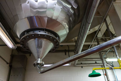 Low angle view of illuminated lights hanging from ceiling