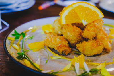 High angle view of fish in plate on table