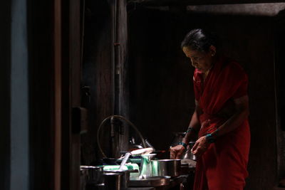 Woman working in kitchen