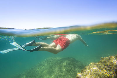 Man swimming in sea